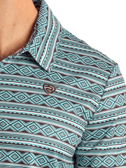 Rock & Roll Denim BM51T05993 Mens Aztec Printed Polo Teal front close up. If you need any assistance with this item or the purchase of this item please call us at five six one seven four eight eight eight zero one Monday through Saturday 10:00a.m EST to 8:00 p.m EST