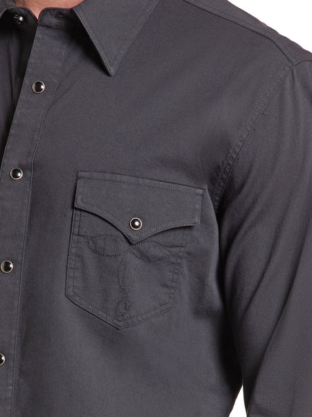 Close-up of a black long-sleeve button-down shirt with a chest pocket and metal snap buttons. If you need any assistance with this item or the purchase of this item please call us at five six one seven four eight eight eight zero one Monday through Saturday 10:00a.m EST to 8:00 p.m EST