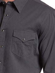 Close-up of a black long-sleeve button-down shirt with a chest pocket and metal snap buttons. If you need any assistance with this item or the purchase of this item please call us at five six one seven four eight eight eight zero one Monday through Saturday 10:00a.m EST to 8:00 p.m EST