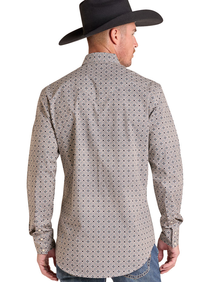 A man wearing a black cowboy hat and a long-sleeve western button-up shirt with a small geometric pattern in beige, gray, and black, paired with blue jeans against a white background. If you need any assistance with this item or the purchase of this item please call us at five six one seven four eight eight eight zero one Monday through Saturday 10:00a.m EST to 8:00 p.m EST