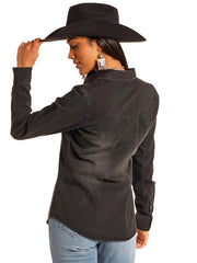A woman wearing a washed black western-style long-sleeve shirt and a black wide-brim hat, shown from a three-quarters back view against a white background. If you need any assistance with this item or the purchase of this item please call us at five six one seven four eight eight eight zero one Monday through Saturday 10:00a.m EST to 8:00 p.m EST