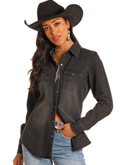 A woman wearing a dark charcoal gray washed denim western shirt, a black cowboy hat, and light blue jeans, photographed against a solid white background. If you need any assistance with this item or the purchase of this item please call us at five six one seven four eight eight eight zero one Monday through Saturday 10:00a.m EST to 8:00 p.m EST