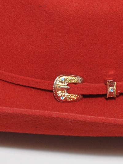 Bullhide KINGMAN 4X 0550R Western Felt Hat Red hant band buckle close up. If you need any assistance with this item or the purchase of this item please call us at five six one seven four eight eight eight zero one Monday through Saturday 10:00a.m EST to 8:00 p.m EST