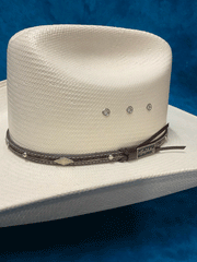 Larry Mahan MS2442BRNX44 10X Brindle 4.5 INCH BRIM Straw Hat Natural band close up. If you need any assistance with this item or the purchase of this item please call us at five six one seven four eight eight eight zero one Monday through Saturday 10:00a.m EST to 8:00 p.m EST