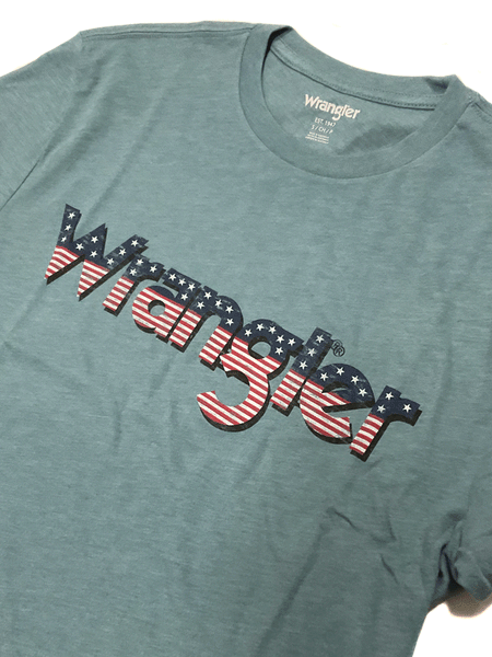 Wrangler 112336214 Mens American Flag Logo T-Shirt Medium Blue front close up. If you need any assistance with this item or the purchase of this item please call us at five six one seven four eight eight eight zero one Monday through Saturday 10:00a.m EST to 8:00 p.m EST