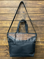 Nocona N770010601 Womens Stacey Style Conceal Carry Tote Black front view hanging. If you need any assistance with this item or the purchase of this item please call us at five six one seven four eight eight eight zero one Monday through Saturday 10:00a.m EST to 8:00 p.m EST