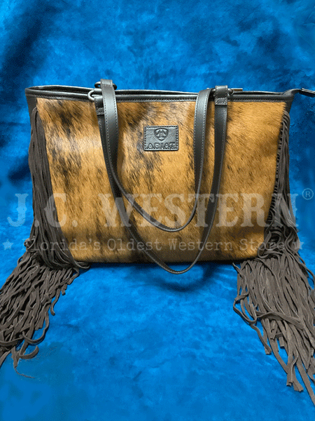 Ariat A770006702 Womens Scarlett Wide Tote Calf Hair Fringe Brown alternate front view. If you need any assistance with this item or the purchase of this item please call us at five six one seven four eight eight eight zero one Monday through Saturday 10:00a.m EST to 8:00 p.m EST