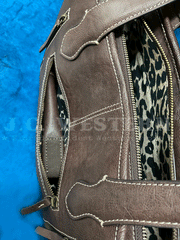 Ariat A770008002 Womens Calf Hair Patchwork Savannah Collection Tote Brown gun pocket view. If you need any assistance with this item or the purchase of this item please call us at five six one seven four eight eight eight zero one Monday through Saturday 10:00a.m EST to 8:00 p.m EST