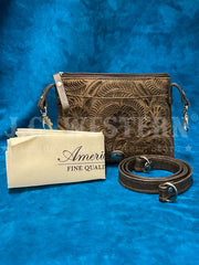 American West 1583884 Ladies Hand Tooled Hip Crossbody Leather Bag  Dark Brown front view with protective bag and strap. If you need any assistance with this item or the purchase of this item please call us at five six one seven four eight eight eight zero one Monday through Saturday 10:00a.m EST to 8:00 p.m EST