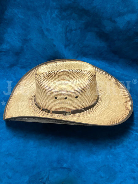 Justin JS1956TRGR44 TRIGGER Bent Rail Straw Cowboy Hat Tan left side view. If you need any assistance with this item or the purchase of this item please call us at five six one seven four eight eight eight zero one Monday through Saturday 10:00a.m EST to 8:00 p.m EST