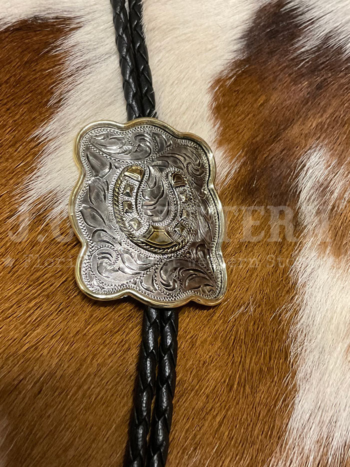 Fashionwest AC80HS Horseshoe Western Bolo Tie Gold And Silver close up. If you need any assistance with this item or the purchase of this item please call us at five six one seven four eight eight eight zero one Monday through Saturday 10:00a.m EST to 8:00 p.m EST