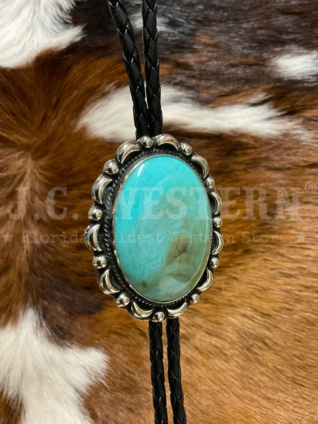 Fashionwest AC53T Large Oval Stone Western Bolo Tie Turquoise close up. If you need any assistance with this item or the purchase of this item please call us at five six one seven four eight eight eight zero one Monday through Saturday 10:00a.m EST to 8:00 p.m EST