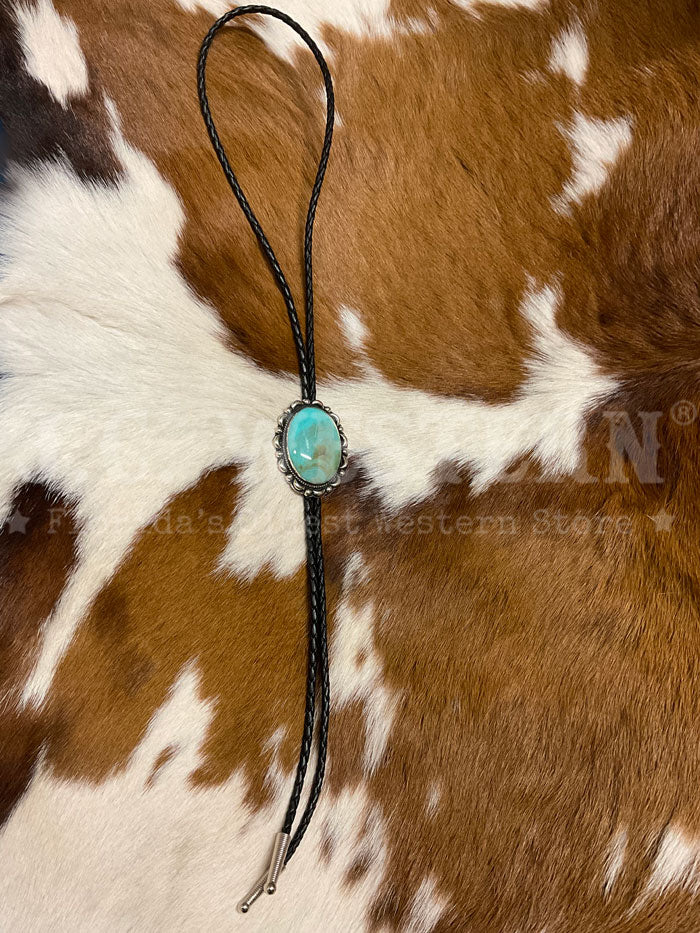 Fashionwest AC53T Large Oval Stone Western Bolo Tie Turquoise close up. If you need any assistance with this item or the purchase of this item please call us at five six one seven four eight eight eight zero one Monday through Saturday 10:00a.m EST to 8:00 p.m EST
