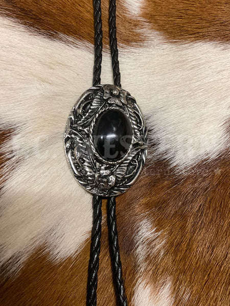 Fashionwest 1138B Small Oval Stone Western Bolo Tie Black front view. If you need any assistance with this item or the purchase of this item please call us at five six one seven four eight eight eight zero one Monday through Saturday 10:00a.m EST to 8:00 p.m EST