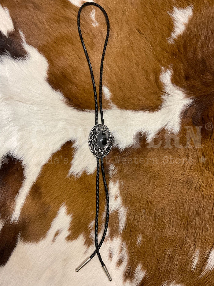 Fashionwest 1138B Small Oval Stone Western Bolo Tie Black  close up. If you need any assistance with this item or the purchase of this item please call us at five six one seven four eight eight eight zero one Monday through Saturday 10:00a.m EST to 8:00 p.m EST
