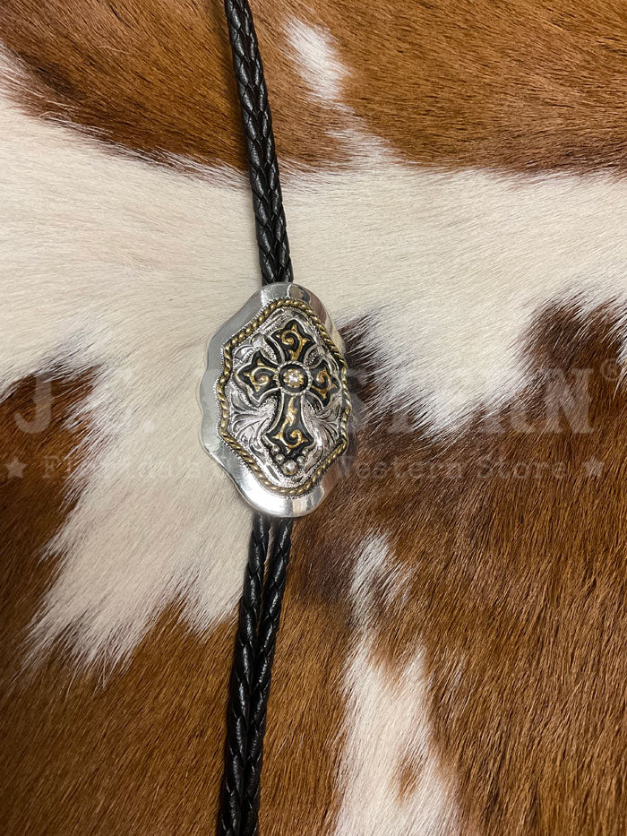 Fashionwest AC69G Cross On Shield Western Bolo Tie Gold And Silver close up. If you need any assistance with this item or the purchase of this item please call us at five six one seven four eight eight eight zero one Monday through Saturday 10:00a.m EST to 8:00 p.m EST