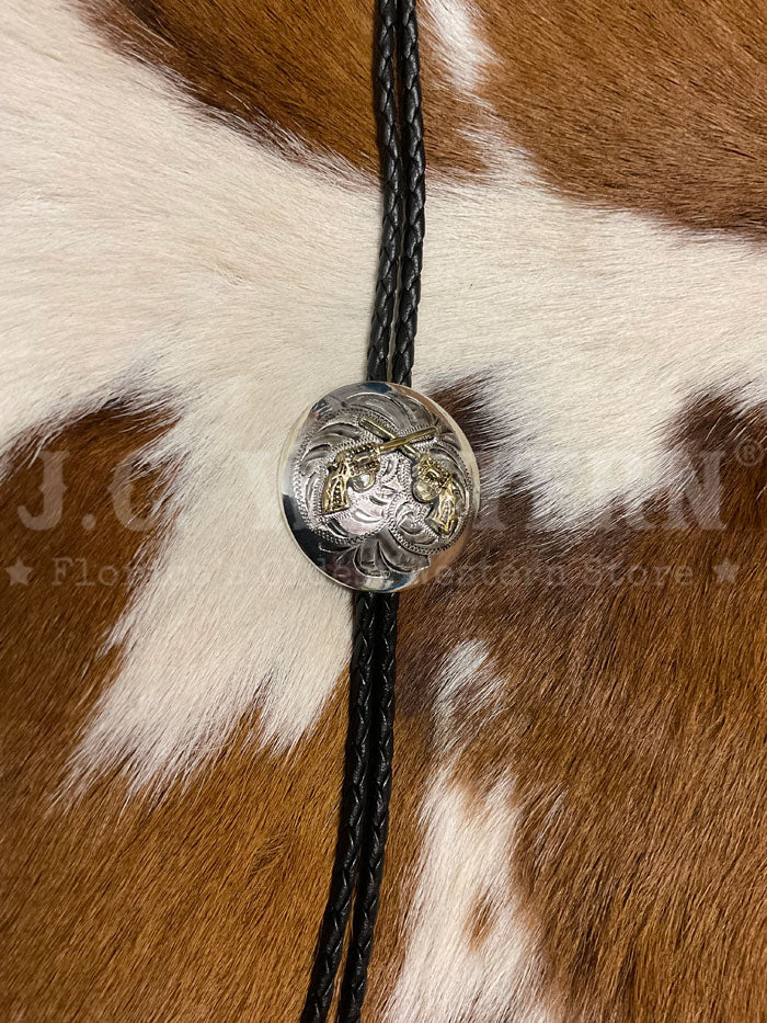 Fashionwest AC70G Crossed Pistols Western Bolo Tie Gold And Silver close up. If you need any assistance with this item or the purchase of this item please call us at five six one seven four eight eight eight zero one Monday through Saturday 10:00a.m EST to 8:00 p.m EST