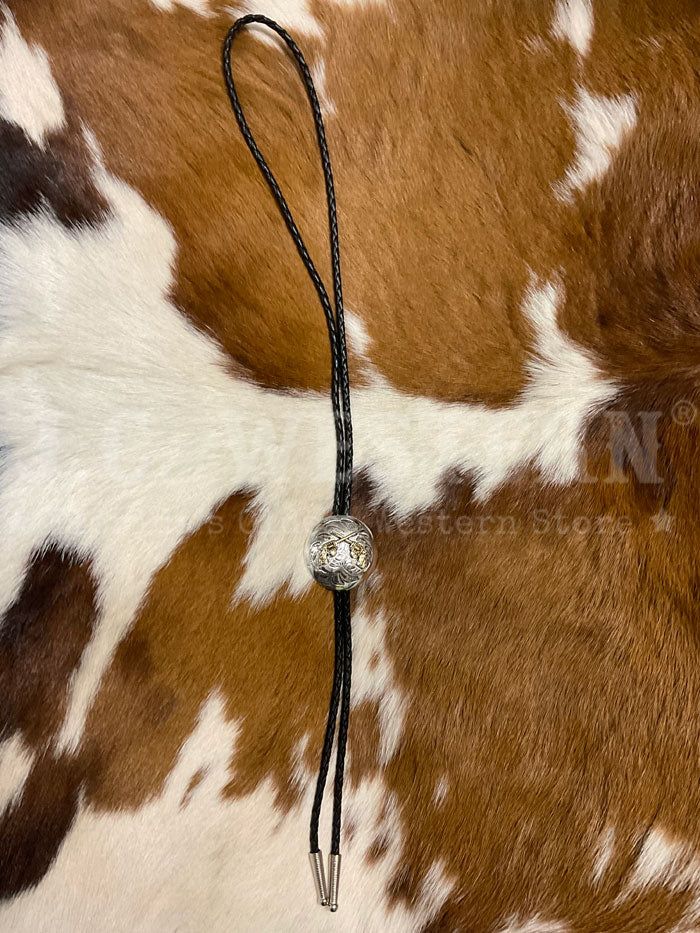 Fashionwest AC70G Crossed Pistols Western Bolo Tie Gold And Silver close up. If you need any assistance with this item or the purchase of this item please call us at five six one seven four eight eight eight zero one Monday through Saturday 10:00a.m EST to 8:00 p.m EST