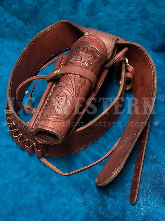Western Express GB-45W Tooled Leather Single Holster Belt Wine Burgundy close up. If you need any assistance with this item or the purchase of this item please call us at five six one seven four eight eight eight zero one Monday through Saturday 10:00a.m EST to 8:00 p.m EST