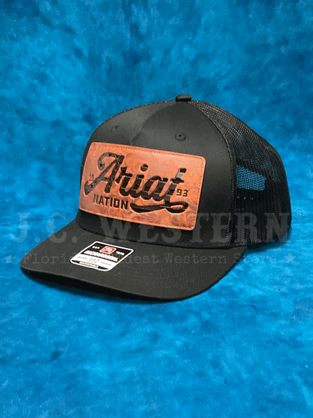 Ariat A300086201 Faux Leather Patch Cap Black front and side view. If you need any assistance with this item or the purchase of this item please call us at five six one seven four eight eight eight zero one Monday through Saturday 10:00a.m EST to 8:00 p.m EST