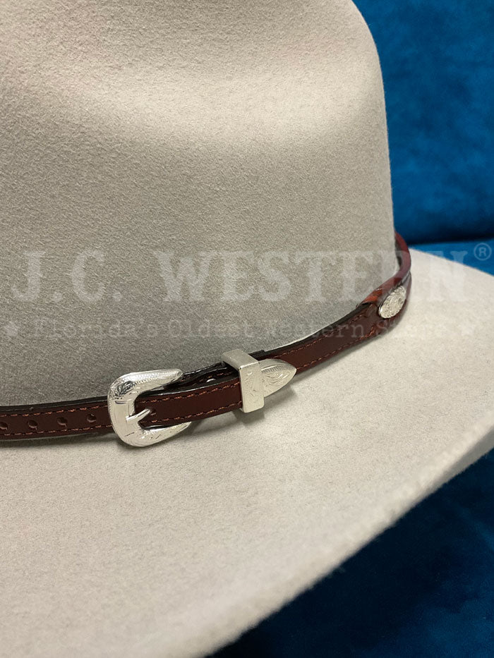 Fashionwest LC-23-BR Silver Conchos Leather Hatband Brown front view on hat. If you need any assistance with this item or the purchase of this item please call us at five six one seven four eight eight eight zero one Monday through Saturday 10:00a.m EST to 8:00 p.m EST