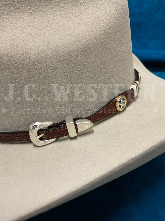 Fashionwest LC-26-2-BR Stars Leather Hatband Brown buckle view. If you need any assistance with this item or the purchase of this item please call us at five six one seven four eight eight eight zero one Monday through Saturday 10:00a.m EST to 8:00 p.m EST