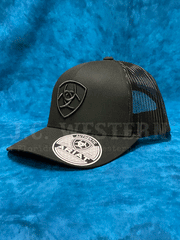 Ariat A300053001 Snapback Shield Logo Cap Black side view. If you need any assistance with this item or the purchase of this item please call us at five six one seven four eight eight eight zero one Monday through Saturday 10:00a.m EST to 8:00 p.m EST