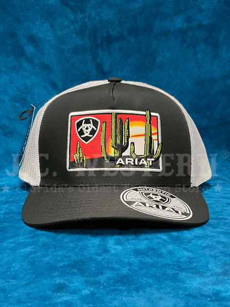 Ariat A300085701 Mens Desert Scene Patch Cap Black front. If you need any assistance with this item or the purchase of this item please call us at five six one seven four eight eight eight zero one Monday through Saturday 10:00a.m EST to 8:00 p.m EST