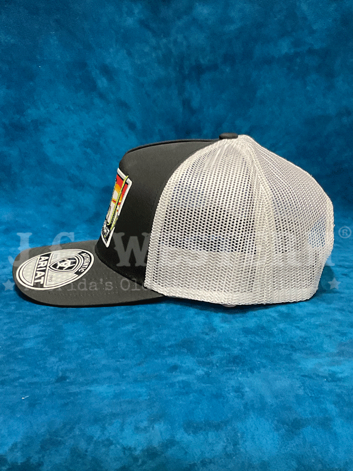 Ariat A300085701 Mens Desert Scene Patch Cap Black front. If you need any assistance with this item or the purchase of this item please call us at five six one seven four eight eight eight zero one Monday through Saturday 10:00a.m EST to 8:00 p.m EST