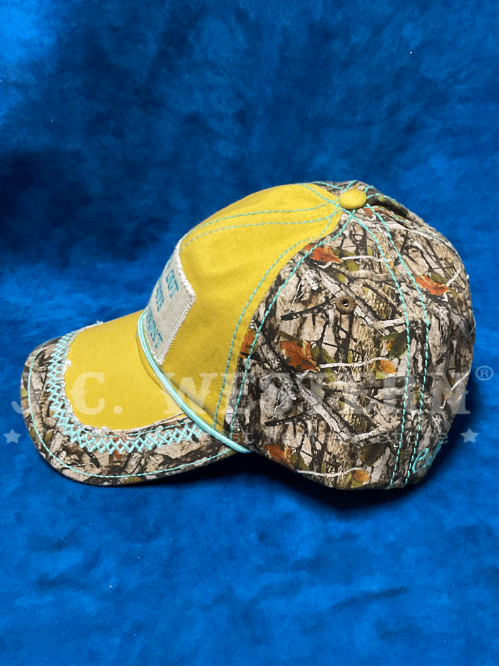 Catchfly 23204HB7 Womens Watch Out Cowboys Ponytail Ball Cap Gold and Camo front view. If you need any assistance with this item or the purchase of this item please call us at five six one seven four eight eight eight zero one Monday through Saturday 10:00a.m EST to 8:00 p.m EST