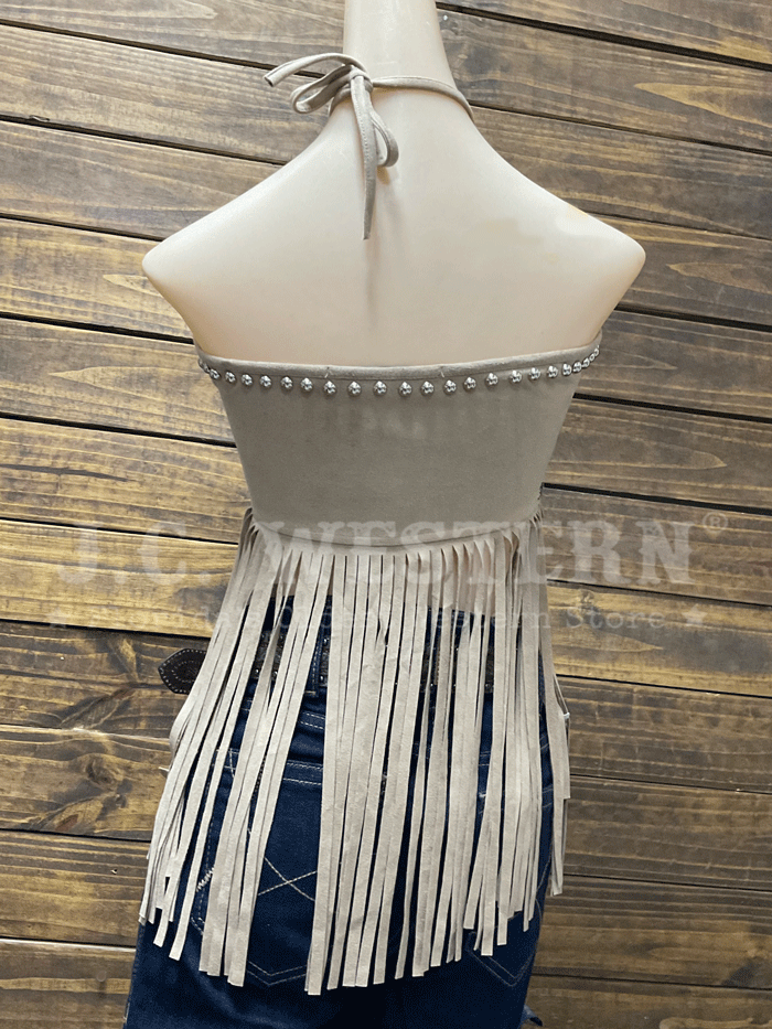 Lucky & Blessed TO844-SND Womens Suede Halter Fringed Top Sand front view on model. If you need any assistance with this item or the purchase of this item please call us at five six one seven four eight eight eight zero one Monday through Saturday 10:00a.m EST to 8:00 p.m EST