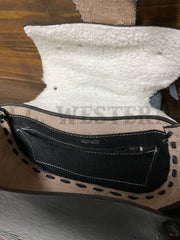 South Bay Leather WS-BK Womens Tooled Saddle Purse Black inside view. If you need any assistance with this item or the purchase of this item please call us at five six one seven four eight eight eight zero one Monday through Saturday 10:00a.m EST to 8:00 p.m EST