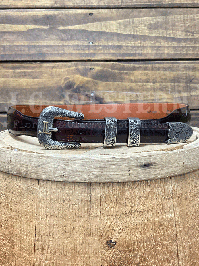 Lucchese W03106-6301-36 Custom Smooth Goat Leather Tapered Belt Black Cherry Size 36 front view rolled. If you need any assistance with this item or the purchase of this item please call us at five six one seven four eight eight eight zero one Monday through Saturday 10:00a.m EST to 8:00 p.m EST


