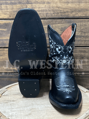 Black cowboy boots with white embroidery on a wooden surface, front and sole view. If you need any assistance with this item or the purchase of this item please call us at five six one seven four eight eight eight zero one Monday through Saturday 10:00a.m EST to 8:00 p.m EST