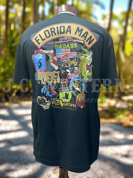 FloGrown FGM-1849 Mens Florida Man Badges Tee Black back view. If you need any assistance with this item or the purchase of this item please call us at five six one seven four eight eight eight zero one Monday through Saturday 10:00a.m EST to 8:00 p.m EST