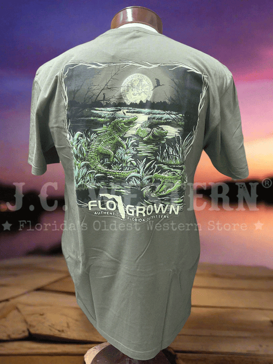 Green t-shirt with nature graphic and on a wooden surface with sunset background back view. If you need any assistance with this item or the purchase of this item please call us at five six one seven four eight eight eight zero one Monday through Saturday 10:00a.m EST to 8:00 p.m EST