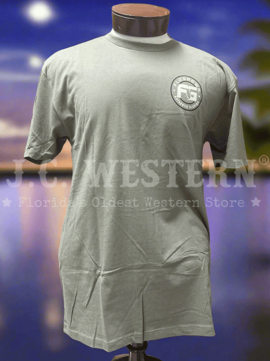 Green t-shirt with a logo on a mannequin with outdoor background front view. If you need any assistance with this item or the purchase of this item please call us at five six one seven four eight eight eight zero one Monday through Saturday 10:00a.m EST to 8:00 p.m EST