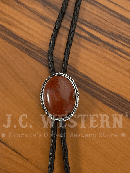 Fashionwest 1182-03 Oval Stone Western Bolo Tie Cognac close up. If you need any assistance with this item or the purchase of this item please call us at five six one seven four eight eight eight zero one Monday through Saturday 10:00a.m EST to 8:00 p.m EST