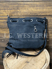 Montana West MW1349-8311BK Womens Hair On Cowhide Drawstring Crossbody Bucket Bag Black back view. If you need any assistance with this item or the purchase of this item please call us at five six one seven four eight eight eight zero one Monday through Saturday 10:00a.m EST to 8:00 p.m EST
