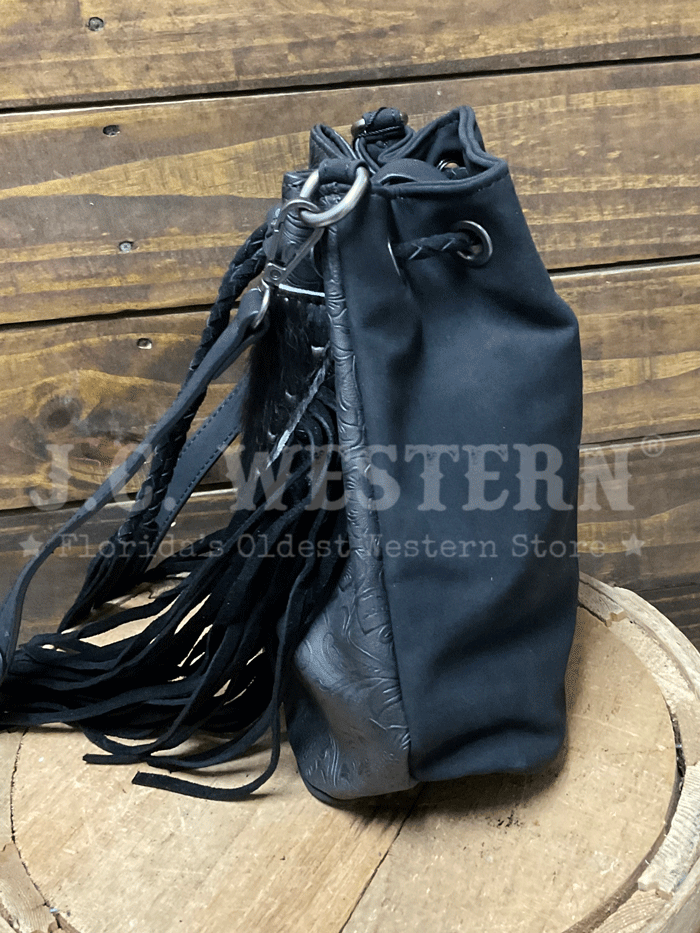 Montana West MW1349-8311BK Womens Hair On Cowhide Drawstring Crossbody Bucket Bag Black front view. If you need any assistance with this item or the purchase of this item please call us at five six one seven four eight eight eight zero one Monday through Saturday 10:00a.m EST to 8:00 p.m EST