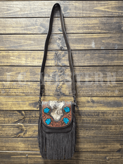 Trinity Ranch TR187-8360CF Womens Genuine Hair On Cowhide Tooled Fringe Crossbody Bag Coffee hangin front view. If you need any assistance with this item or the purchase of this item please call us at five six one seven four eight eight eight zero one Monday through Saturday 10:00a.m EST to 8:00 p.m EST
