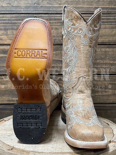 Corral T0239 Teens Floral Embroidery Square Toe Boot Tan sole and front view. If you need any assistance with this item or the purchase of this item please call us at five six one seven four eight eight eight zero one Monday through Saturday 10:00a.m EST to 8:00 p.m EST