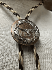 Cowboy Collectibles BOLT506 The Longhorn Bolo Tie Creme And Dark Sorrel close up. If you need any assistance with this item or the purchase of this item please call us at five six one seven four eight eight eight zero one Monday through Saturday 10:00a.m EST to 8:00 p.m EST