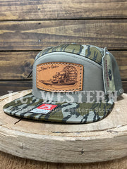 Shoot & Reel SR8-MOBL Air Boat Patch Flat Bill Cap Mossy Oak Bottomland Loden side / front view. If you need any assistance with this item or the purchase of this item please call us at five six one seven four eight eight eight zero one Monday through Saturday 10:00a.m EST to 8:00 p.m EST