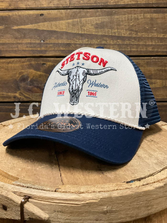 Stetson SCSK6T-0003DMAL Skull Trucker Cap Denim side / front view. If you need any assistance with this item or the purchase of this item please call us at five six one seven four eight eight eight zero one Monday through Saturday 10:00a.m EST to 8:00 p.m EST