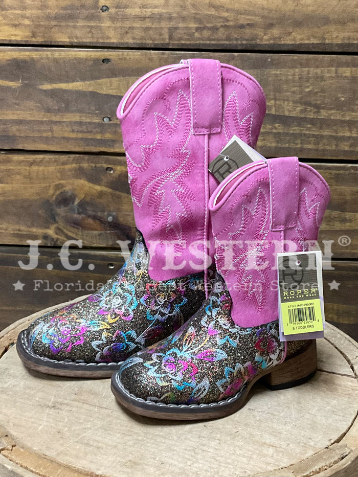 Roper 3857 Kids Glitter Rose Square Toe Western Boot Pink front and outter side view. If you need any assistance with this item or the purchase of this item please call us at five six one seven four eight eight eight zero one Monday through Saturday 10:00a.m EST to 8:00 p.m EST
