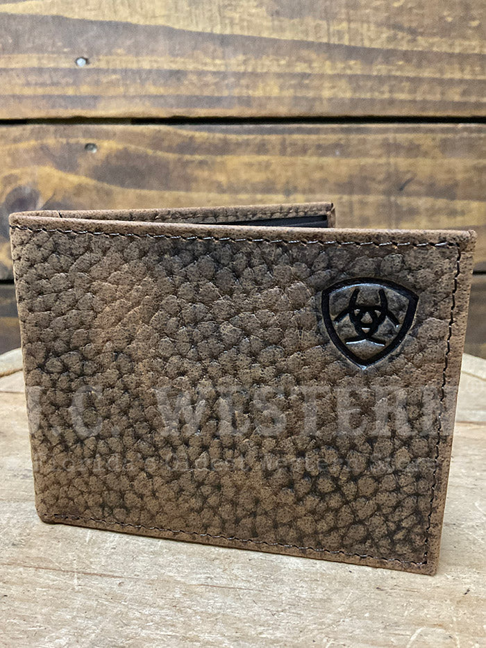 Ariat A3547602 Mens Bifold Shield Logo Wallet Brown front view. If you need any assistance with this item or the purchase of this item please call us at five six one seven four eight eight eight zero one Monday through Saturday 10:00a.m EST to 8:00 p.m EST