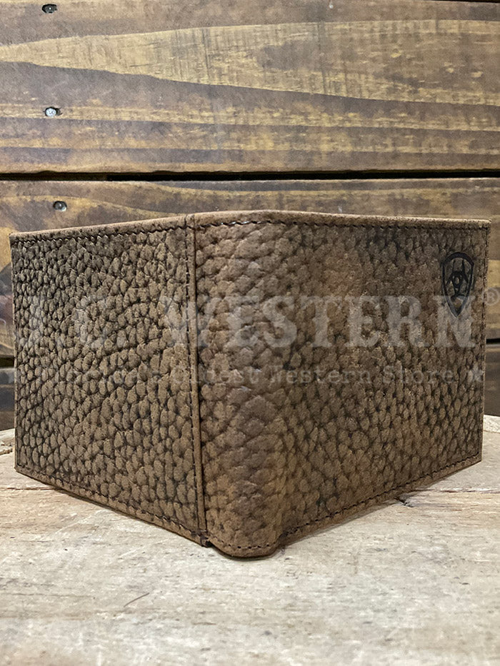 Ariat A3547602 Mens Bifold Shield Logo Wallet Brown front view. If you need any assistance with this item or the purchase of this item please call us at five six one seven four eight eight eight zero one Monday through Saturday 10:00a.m EST to 8:00 p.m EST