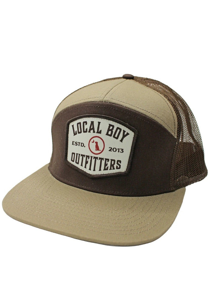 Local Boy Outfitters L3000796-LTBB Butcher Patch 7 Panel Hat Light Brown Brown front view. If you need any assistance with this item or the purchase of this item please call us at five six one seven four eight eight eight zero one Monday through Saturday 10:00a.m EST to 8:00 p.m EST