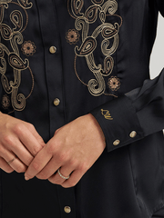 Wrangler 112373689 Womens X Lainey Wilson Embroidered Shirt Black cuff close up. If you need any assistance with this item or the purchase of this item please call us at five six one seven four eight eight eight zero one Monday through Saturday 10:00a.m EST to 8:00 p.m EST